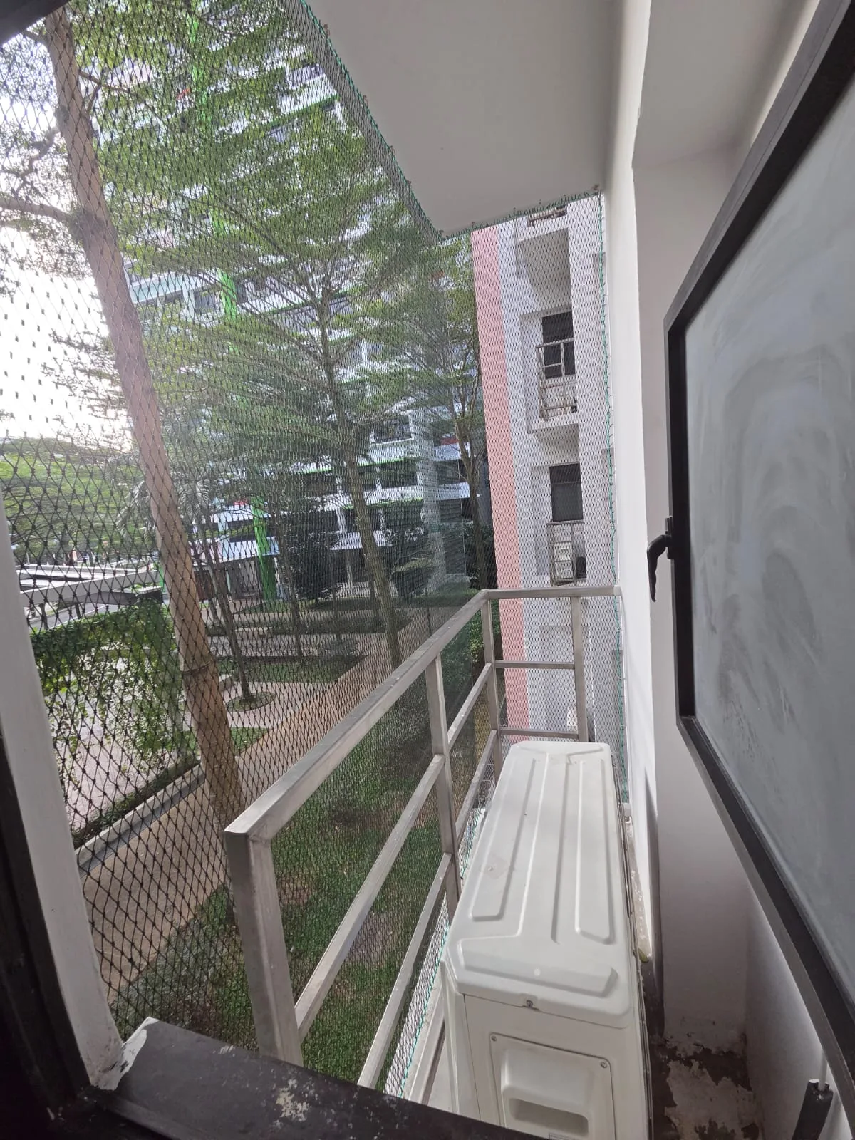 Completed bird netting installation aircon ledge Singapore